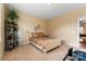 Cozy bedroom featuring a bed, houseplants, and view into billiard room at 16023 Rushwick Dr, Huntersville, NC 28078