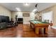 Game room featuring a pool table and exercise equipment on hardwood floors at 16023 Rushwick Dr, Huntersville, NC 28078