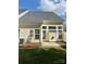 The home's rear exterior features neutral siding and a door leading to the patio at 1629 Backcreek Ln, Gastonia, NC 28054