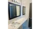 This bathroom offers a modern sink with a quartz countertop and a framed mirror at 1629 Backcreek Ln, Gastonia, NC 28054