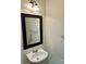 Cozy half-bath with modern mirror, lighting fixture, and sink at 1629 Backcreek Ln, Gastonia, NC 28054