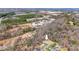 Aerial view of the property, highlighting its proximity to nearby buildings and foliage at 1740 Young Dr, Conover, NC 28613