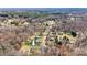 Aerial view showing the property surrounded by trees and neighboring homes at 1740 Young Dr, Conover, NC 28613