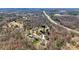 Aerial view of the property situated among lush trees and close to a highway at 1740 Young Dr, Conover, NC 28613