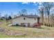 Spacious backyard featuring access to the basement, a covered patio, and lovely lawn at 1740 Young Dr, Conover, NC 28613