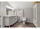 A bright bathroom features a double sink vanity, a medicine cabinet and a toilet at 1740 Young Dr, Conover, NC 28613