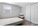 Cozy bedroom with minimalist decor featuring a platform bed, a window, and closet with bi-fold doors at 1740 Young Dr, Conover, NC 28613