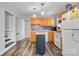 A bright kitchen featuring honey colored cabinets, mosaic backsplash and island at 1740 Young Dr, Conover, NC 28613