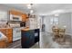 A well-lit kitchen featuring honey colored cabinets and stainless steel appliances at 1740 Young Dr, Conover, NC 28613