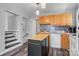 A bright kitchen featuring honey colored cabinets, mosaic backsplash and island at 1740 Young Dr, Conover, NC 28613