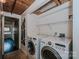 Laundry room featuring a washer and dryer, with wood ceiling at 201 S Hoskins Rd # 131, Charlotte, NC 28208