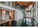 Living room featuring stairs to a loft, with kitchen and bathroom in the background at 201 S Hoskins Rd # 131, Charlotte, NC 28208