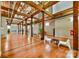 Spacious living area with hardwood floors, high ceilings, wood beams and pillars at 201 S Hoskins Rd # 131, Charlotte, NC 28208