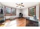 Bedroom with hardwood floors, two windows, and a ceiling fan at 201 Wiley Ave, York, SC 29745