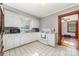 Kitchen featuring white cabinets, marble countertops and white appliances at 201 Wiley Ave, York, SC 29745