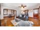 Inviting living room with hardwood floors, ceiling fan, and neutral gray paint scheme at 201 Wiley Ave, York, SC 29745