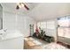 Enclosed porch featuring multiple windows for natural light and a washing machine and dryer hookup at 201 Wiley Ave, York, SC 29745