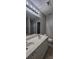 A full bathroom with a double sink vanity, a toilet, and a door to a walk-in closet at 2108 Cranberry Woods Ct, Charlotte, NC 28208