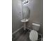 Bathroom featuring a modern sink, toilet, and contemporary finishes at 2108 Cranberry Woods Ct, Charlotte, NC 28208