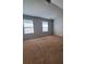 Spacious bedroom with neutral carpet, two windows, and fresh paint at 2108 Cranberry Woods Ct, Charlotte, NC 28208