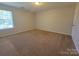 Bedroom featuring neutral carpet and one large window at 2108 Cranberry Woods Ct, Charlotte, NC 28208