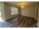 Dining room with modern lighting fixture and a large window for natural light at 2108 Cranberry Woods Ct, Charlotte, NC 28208