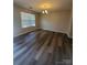 The dining room features modern lighting, neutral walls and laminate flooring at 2108 Cranberry Woods Ct, Charlotte, NC 28208