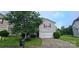 Charming two-story home with a well-maintained front yard and attached garage at 2108 Cranberry Woods Ct, Charlotte, NC 28208