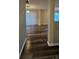 Hallway with wood-look floors that leads to the living areas, offering a seamless transition throughout the home at 2108 Cranberry Woods Ct, Charlotte, NC 28208