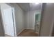 Hallway with light neutral walls, carpet, and white trim at 2108 Cranberry Woods Ct, Charlotte, NC 28208