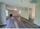 Bright living room with fireplace, complemented by hard surface floors and neutral walls at 2108 Cranberry Woods Ct, Charlotte, NC 28208