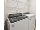 Laundry room featuring a modern washer and dryer, plus a wire shelving unit at 2130 Old Rivers Rd, Concord, NC 28027