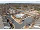 Aerial view of the neighborhood amenities featuring a pool, clubhouse and parking at 2592 Brackley Nw Pl, Concord, NC 28027