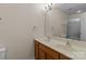 Double sink vanity in the bathroom with wood cabinets and a large mirror at 2592 Brackley Nw Pl, Concord, NC 28027