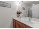 Well-lit bathroom with double sinks and a framed mirror at 2592 Brackley Nw Pl, Concord, NC 28027