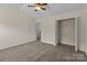 Well-lit bedroom with a closet, perfect for comfortable living and storage at 2592 Brackley Nw Pl, Concord, NC 28027