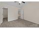 Spacious bedroom featuring neutral walls and a walk-in closet for ample storage at 2592 Brackley Nw Pl, Concord, NC 28027