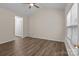Spacious bedroom features wood-look floors, ceiling fan, vaulted ceiling, and a bright window at 2592 Brackley Nw Pl, Concord, NC 28027