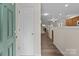 Bright entryway with wood-look floors leading to an open-concept living space at 2592 Brackley Nw Pl, Concord, NC 28027