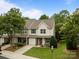 Charming townhome with a one-car garage, green shutters, and a well-maintained lawn at 2592 Brackley Nw Pl, Concord, NC 28027