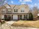 Charming two-story townhouse with a one-car garage, well-maintained lawn, and inviting curb appeal at 2592 Brackley Nw Pl, Concord, NC 28027