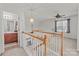 Hallway with open view to bath area with a view to the upstairs bonus area at 2592 Brackley Nw Pl, Concord, NC 28027