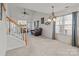 Open living room with fireplace, neutral carpet, vaulted ceiling and lots of natural light at 2592 Brackley Nw Pl, Concord, NC 28027