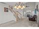 Open living room with fireplace, neutral carpet, vaulted ceiling and lots of natural light at 2592 Brackley Nw Pl, Concord, NC 28027