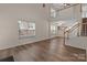 Bright living room with modern flooring and windows at 2592 Brackley Nw Pl, Concord, NC 28027