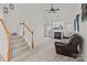 Living room featuring vaulted ceilings, neutral carpet, a fireplace, and an open floor plan at 2592 Brackley Nw Pl, Concord, NC 28027