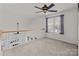 Bright loft area with white railing, ceiling fan, and window with natural light at 2592 Brackley Nw Pl, Concord, NC 28027