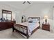 Comfortable main bedroom featuring neutral carpet, a dresser with mirror and two nightstands at 2592 Brackley Nw Pl, Concord, NC 28027