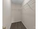 Functional walk-in closet with sturdy shelving to maximize organization at 2592 Brackley Nw Pl, Concord, NC 28027