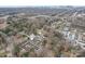 Aerial view of the townhome community, showcasing its proximity to the city and surrounding green spaces at 3010 Uxbridge Woods Ct, Charlotte, NC 28205